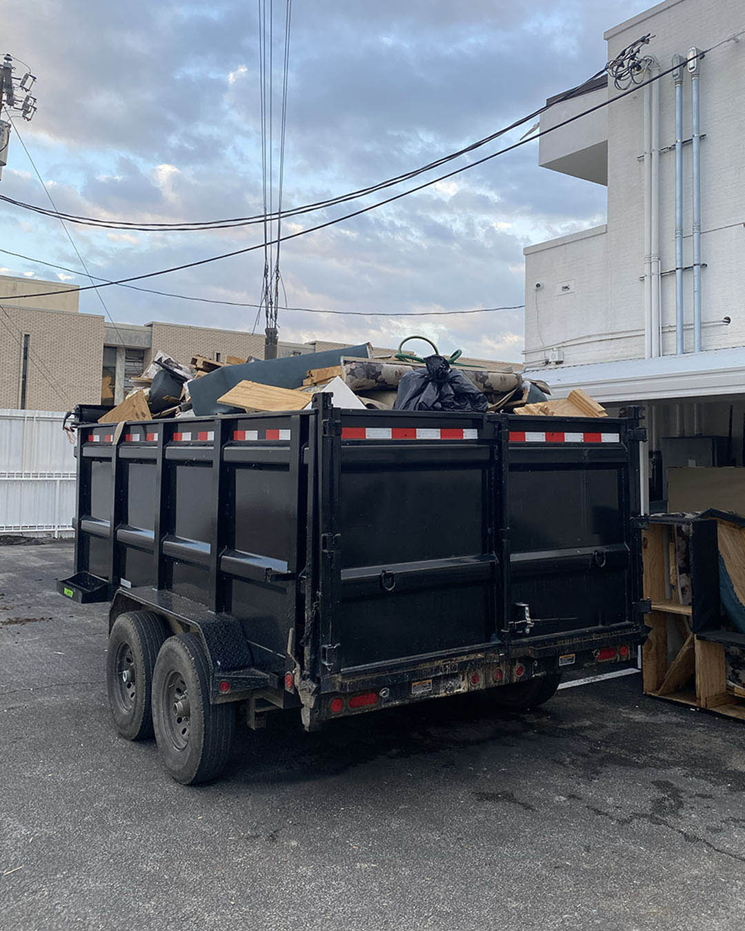Junk removal truck with workers